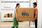 Couple moving house, carrying large cardboard box in sparse room, face to face --- Image by Â© Juice Images/Corbis, Mutari Mobila, Bucuresti