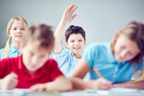 Clever schoolboy raising his hand at lesson bespoke languages tuition (blt) Flat 3, 18 Cavendish Road 