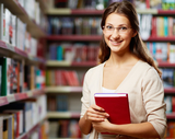 Portrait of clever student with book in college library bespoke languages tuition (blt) Flat 3, 18 Cavendish Road 