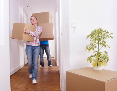 Man and woman moving boxes into their new home. Profile Photos of Man With Van Canonbury 324 Essex Rd - Photo 7 of 9