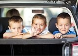 Three children and  mother in the car looking  and waving their hands,  as if saying goodbye to somebody while traveling for a vacation. Selective Focus, focus is on the girl



  
 

 



