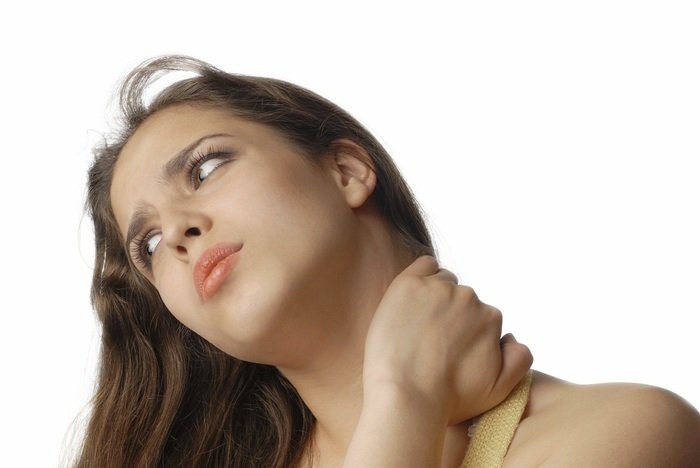 Sad tired woman massaging her neck and suffering from pain  Profile Photos of Global Neuro & Spine Institute - Miami 8501 SW 124th Avenue Suite 108 - Photo 7 of 11