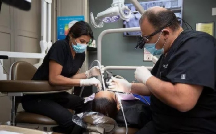 Dentist at work Wisdom Dental of Wisdom Dental 9750 NW 33rd Street, Suite 217 - Photo 2 of 7