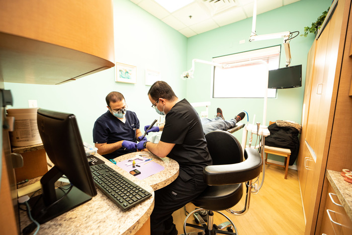 Dr. Sanei at work at Advanced Dentistry at Morton Grove Advanced Dentistry at Morton Grove of Advanced Dentistry at Morton Grove 5821 Dempster Street - Photo 20 of 24
