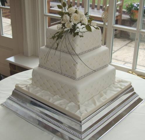 Square cake with quilted side pattern and sugar roses from £385 Profile Photos of Sharon Lord Cakes Fiddlers Field Croydon Road - Photo 4 of 21 Square cake with quilted side pattern and sugar roses from £385 Profile Photos of Sharon Lord Cakes Fiddlers Field Croydon Road - Photo 4 of 21