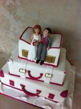 Stacked suitcases with handmade bride and groom from Â£410 Sharon Lord Cakes Fiddlers Field Croydon Road 