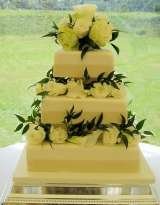 Ivory cake with fresh roses from Â£325 excl roses Sharon Lord Cakes Fiddlers Field Croydon Road 