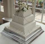 Square cake with quilted side pattern and sugar roses from Â£385 Sharon Lord Cakes Fiddlers Field Croydon Road 