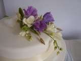Single tier with sugar lisianthus and freesias fromÂ£135 Sharon Lord Cakes Fiddlers Field Croydon Road 
