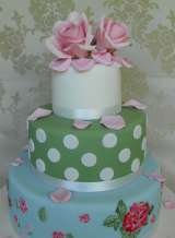 3 tier vintage style with hand painted bottom tier and large sugar rose from Â£385, Sharon Lord Cakes, Westerham