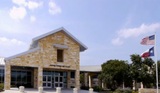 Dripping Springs High School a few paces to the north of Smiles of Dripping Springs Smiles of Dripping Springs 170 Benney Ln #103 