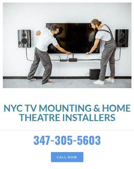 Two professional workmen installing a large TV monitor and audio system Profile Photos of NYC TV Mounting & Home Theatre Installers 415 E 73rd St.,  Apt. 2E. - Photo 1 of 5