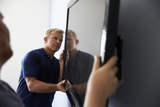 Two Men Fitting Flat Screen Television To Wall, NYC TV Mounting & Home Theatre Installers, New York