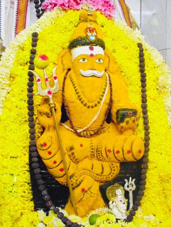 Muneshwara Swamy in Turmeric Alangara Temple Photos of Sri Muneshwara Swamy Temple and Astrology Center Bazaar Street Someshwarpura, Halasuru - Photo 1 of 4