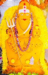 Muneshwara Swamy in Turmeric Alangara V2, Sri Muneshwara Swamy Temple and Astrology Center, Bangalore