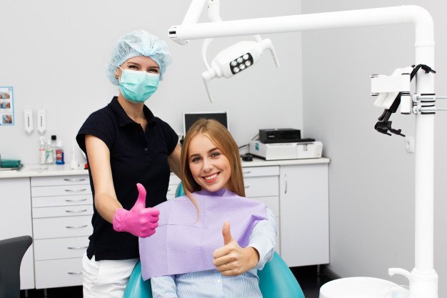A happy dentist and patient post procedure<br />
 New Album of Dentistry at The Grove 2142 Mountain Grove Ave - Photo 8 of 11