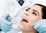 A close-up shot of a patient getting a inspection from a dentist<br />
 Dentistry at The Grove 2142 Mountain Grove Ave 