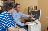 Old Hickory dentist Dr. Atchley talks to patient about dental crown Dental Bliss Hermitage 601 Brandywine Village Ct 
