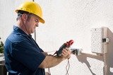 Electrician using a meter to check the voltage on an outdoor receptacle.  Model is a licensed master electrican and all work is performed according to  industry code and safety standards.  , Emergency Electrician Perth, Goodwood