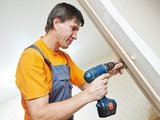 Male handyman carpenter at interior wood door lock installation, Immediate Response Locksmith, San Antonio