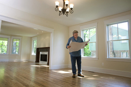 Contractor looking at blueprint  New Album of Cloud Free Windows 1 Westdown Road - Photo 2 of 3