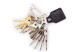 Bunch of keys and leather keychain on white, BH Locksmith, Houston