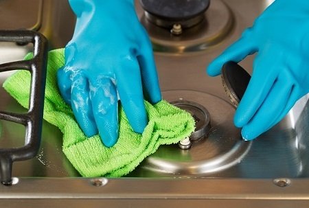 Closeup horizontal image of hands wearing rubber gloves while removing soap from stove top range green with microfiber rag<br />
<br />
New Album of Cleaning Services Toronto Pro 1075 Bay Street #102A - Photo 8 of 9 Closeup horizontal image of hands wearing rubber gloves while removing soap from stove top range green with microfiber rag<br />
<br />
New Album of Cleaning Services Toronto Pro 1075 Bay Street #102A - Photo 8 of 9