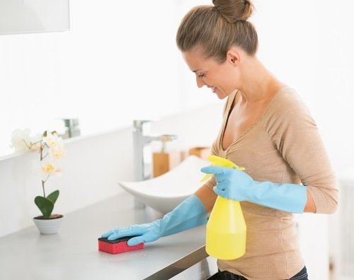 Housewife cleaning desk in bathroom New Album of Cleaning Services Toronto Pro 1075 Bay Street #102A - Photo 9 of 9