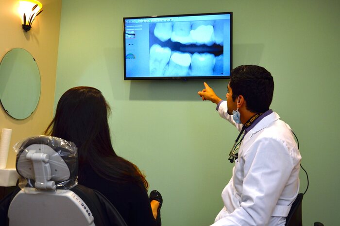 Dallas dentist Dr. Ron Hassanzadeh explaining dental implants Seven Hills Dentistry of Seven Hills Dentistry 1305 Cedarcrest Rd #115 - Photo 25 of 30 Dallas dentist Dr. Ron Hassanzadeh explaining dental implants Seven Hills Dentistry of Seven Hills Dentistry 1305 Cedarcrest Rd #115 - Photo 25 of 30