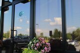 Glass pane with signage on the entrance at Seven Hills Dentistry Dallas GA Seven Hills Dentistry 1305 Cedarcrest Rd #115 