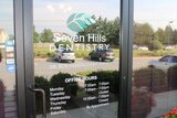 Office hours and signage on the glasspane of entrance door at Seven Hills Dentistry Dallas GA Seven Hills Dentistry 1305 Cedarcrest Rd #115 