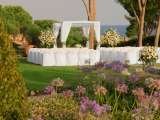 Experience tranquility and elegance in the colourful garden of the St. Regis Mardavall. The St. Regis Mardavall Mallorca Resort Passeig Calvia s/n 