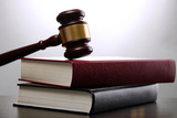 wooden gavel and books on wooden table,on grey background Buntrock Law Group 2158 N. Gilbert Road, Suite 119 