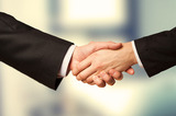 Closeup of a business hand shake between two colleagues Buntrock Law Group 2158 N. Gilbert Road, Suite 119 