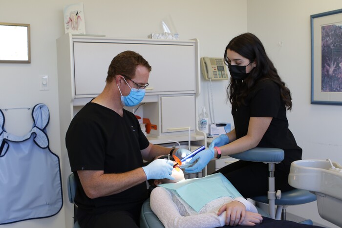 Oakville dentist Dr. Jacobs and dental hygienist performing root canal at Jacobs & Associates Dental Office Oakville dentist of Jacobs & Associates Dental Office 1060 Speers Road Suite 218 - Photo 21 of 22 Oakville dentist Dr. Jacobs and dental hygienist performing root canal at Jacobs & Associates Dental Office Oakville dentist of Jacobs & Associates Dental Office 1060 Speers Road Suite 218 - Photo 21 of 22