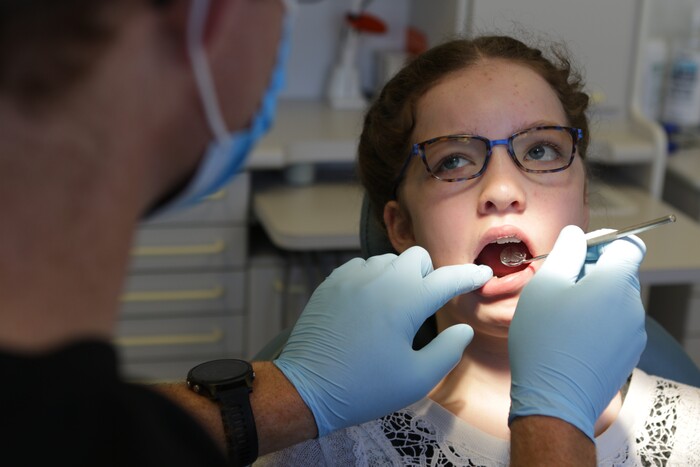 Oakville dentist Dr. Jacobs with orthodontics patient at Jacobs & Associates Dental Office Oakville ON Oakville dentist of Jacobs & Associates Dental Office 1060 Speers Road Suite 218 - Photo 16 of 22 Oakville dentist Dr. Jacobs with orthodontics patient at Jacobs & Associates Dental Office Oakville ON Oakville dentist of Jacobs & Associates Dental Office 1060 Speers Road Suite 218 - Photo 16 of 22