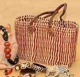 Grass bag with leather trimmins
http://ow.ly/lUD1K 
Free delivery
only Â£14.75, Crafts of the World Online, Codicote