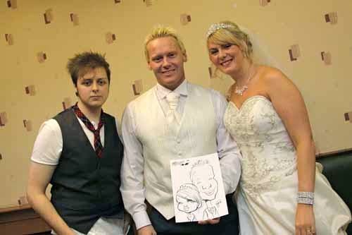 Adam with The Happy Couple  Profile Photos of Crazy Caricatures St Mary Street - Photo 2 of 11