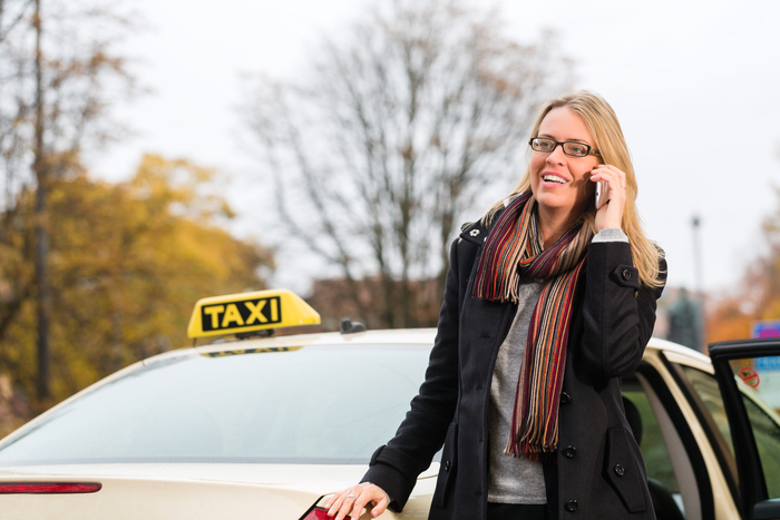 Young woman standing in front of taxi, she gets phone call Profile Photos of Elegant Taxis 34a Bank Street - Photo 1 of 1 Young woman standing in front of taxi, she gets phone call Profile Photos of Elegant Taxis 34a Bank Street - Photo 1 of 1