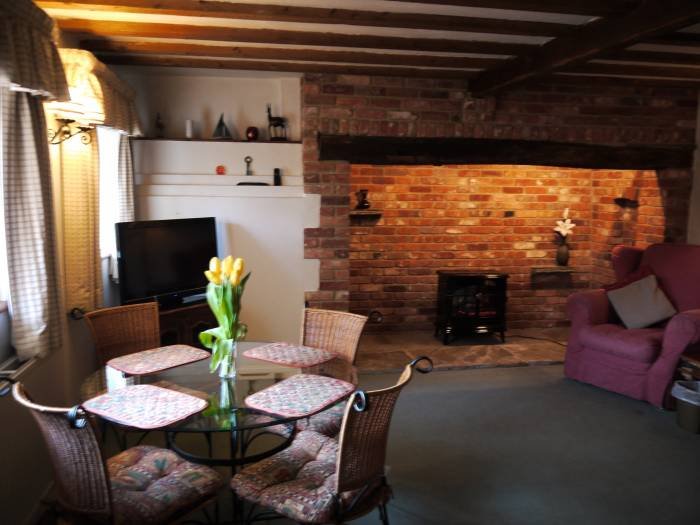 Sitting room / dining room in Annie's Cottage Internal photos of holiday properties. of Manston Court Accommodations Manston Court, Manston Court Road, Manston, - Photo 12 of 18