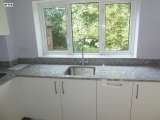 After - High gloss white with granite worktops and all appliances integrated Intoto Kitchens Wokingham 23 Peach Street 