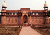 Jehangir's Place, built by Akbar for his son Jehangir. In front is Hauz-i-Jehangir, a huge bowl carved out of a single block of stone,  possibly used for bathing., One Day Agra Packages by Car or Volvo Bus, New Delhi