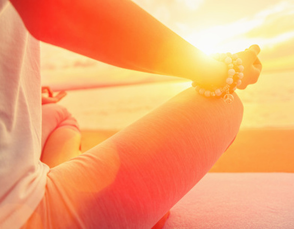 Woman meditating in pose of lotus on beach in summer, close-up. Image with sunlight effect Profile Photos of Morgan Center for Counseling and Wellbeing, Inc. 7860 Glades Road, Suite 225 - Photo 3 of 6