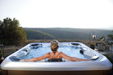 Woman enjoying her new hot tub<br />
 Rocky Mountain Hot Tub Company 102 Continental Ct, C17 