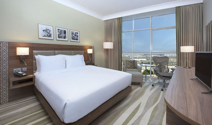 Unwind and relax in one of our comfortable guest rooms.  Hilton Garden Inn Dubai Al Muraqabat of Hilton Garden Inn Dubai Deira Abu Baker Al Siddique Road - Photo 3 of 16