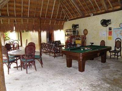 The communal area, pool table, TV, games, darts, tables, all under the palapa roof, Profile Photos of Amigos Hostel Cozumel Calle 7 Sur # 571 x Ave 25 & 30 col. centro - Photo 5 of 7 The communal area, pool table, TV, games, darts, tables, all under the palapa roof, Profile Photos of Amigos Hostel Cozumel Calle 7 Sur # 571 x Ave 25 & 30 col. centro - Photo 5 of 7