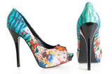 Beautiful multicolored stiletto shoes on white, Footwear firm invests in soles production, Delhi