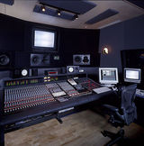 A modern music studio filled with mixing boards, the latest DAW technology and speakers, Blend Mastering | Online Audio Mastering, Brisbane