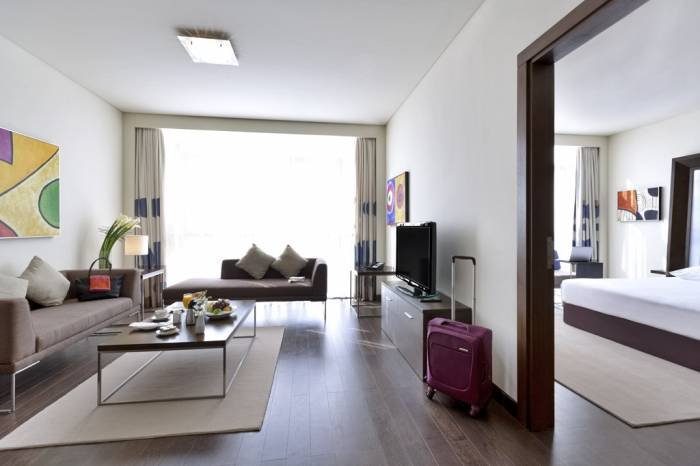 One bed room apartment â€“ living room Profile Photos of Novotel Abu Dhabi Gate Road 34, Gate City Bain Al Jessrain - Photo 1 of 9