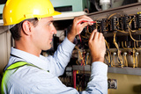 male electrician testing industrial machine, Graham & Sons Professional Electrical Sydney City, Lane Cove West